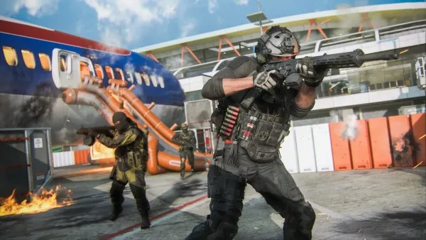 A group of soldiers in combat gear are engaged in a firefight near an airplane on fire. The scene is set at an airport with smoke and flames visible, and the soldiers are equipped with helmets, rifles, and tactical vests. The background features a large aircraft with its door open and emergency slides deployed. The atmosphere is tense and chaotic, suggesting a high-stakes military operation or rescue mission.