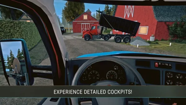 A first-person perspective of a truck driver's cabin, showcasing the detailed interior with gauges and controls. The view outside shows a red barn and a dump truck unloading material in a rural setting. The scene is set during daylight hours, with clear skies and lush greenery surrounding the buildings.